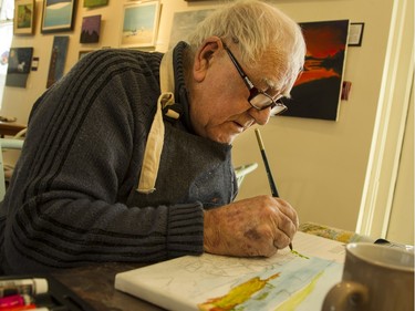 Terry Quickfall began to take part in May Court's day hospice program three years ago, and in particular its painting classes and exercises. He estimates he's done about 160 paintings. A few are displayed on the wall behind him.