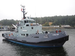 The Department of National Defence is looking at privatizing its tug fleet. In this photo, a DND tug operates at CFB Esquimalt. Photo by David Pugliese