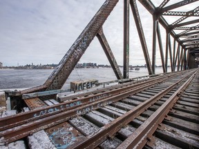 The Prince of Wales Bridge as seen from the Hull/ Gatineau side of the Ottawa River with Ottawa and specifically Lebreton Flats in the distance.   Assignment - 122717 (Wayne Cuddington/ Ottawa Citizen)