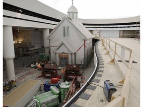 The Ukrainian church, one of the few original artifacts from the old Canada Hall, is covered in plastic as it sits in the new Canada History Hall under construction at the Canadian Museum of History.