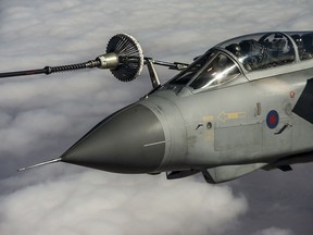 A CC-150T Polaris aircraft provides air-to-air refueling to a Royal Air Force Tornado fighter jet over Iraq during Operation IMPACT on January 25, 2016.

Photo: Op IMPACT, DND
KW04-2016-0026-004
~
Un appareil CC-150T Polaris ravitaille en vol un chasseur à réaction Tornado de la Royal Air Force au dessus de l’Irak, au cours de l’opération IMPACT, le 25 janvier 2016.

Photo : Op IMPACT, MDN
KW04-2016-0026-004