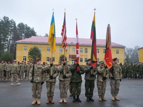 Canadian, Ukrainian, U.S. and Lithuania soldiers display their flags during the opening ceremony of joint training exercises, in the Lviv region, western Ukraine in November.