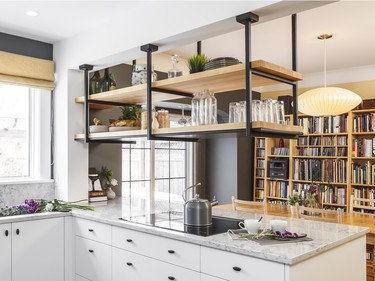Another trend in hood fans: Using a downdraft hood to free up the space above for a steel & butcher block floating shelving unit, like this project by Nathan Kyle of Astro Design Centre.
