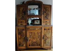Even though dining furniture is not a hot collectible right now, this Art Deco china cabinet and the set it goes with are worth at least $6,500.