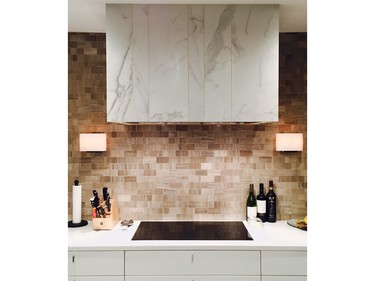 Another option for hood fans is tiling a drywall enclosure, like this project by Nathan Kyle at Astro Design Centre.