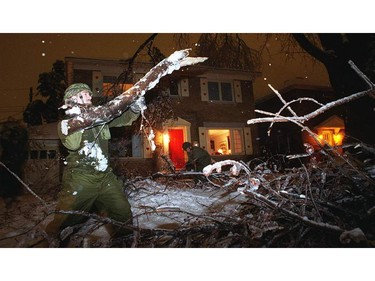 Jan 9, 1998--  Members of the Royal Canadian Dragoons pitch in to clear brush along Southern Dr in the Riverdale area.