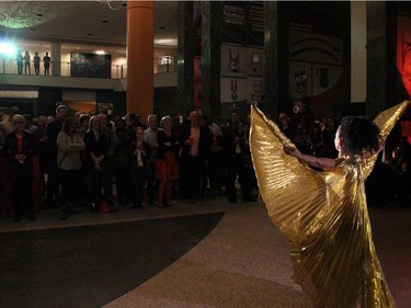 Audience members watch with interest a dance performance by Syreeta Barnett at On the  Rocks: In the Caribbean, an annual Winterlude party hosted by the Ottawa Art Gallery at City Hall on Friday, February 5, 2016. (Caroline Phillips / Ottawa Citizen)