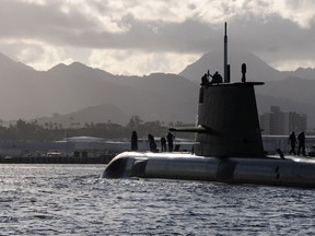 140719-N-LY466-101
PEARL HARBOR (July 19, 2014) The Royal Australian submarine HMAS Sheean (SSG 77) enters Pearl Harbor during Rim of the Pacific Exercise 2014. Twenty-two nations, 49 ships, six submarines, more than 200 aircraft and 25,000 personnel are participating in RIMPAC from June 26 to Aug. 1 in and around the Hawaiian Islands and Southern California. The world's largest international maritime exercise, RIMPAC provides a unique training opportunity that helps participants foster and sustain the cooperative relationships that are critical to ensuring the safety of sea lanes and security on the world's oceans. RIMPAC 2014 is the 24th exercise in the series that began in 1971. (U.S. Navy by Chief Mass Communication Specialist/Released)