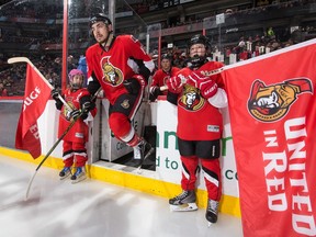 Making his NHL debut, Nicholas Paul #13 of the Ottawa Senators steps onto the ice during player introductions.