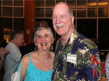 Canada's Official Languages Commissioner Graham Fraser and his wife, Barbara Uteck, dressed for the occasion at On the  Rocks: In the Caribbean, an annual Winterlude party hosted by the Ottawa Art Gallery at City Hall on Friday, February 5, 2016. (Caroline Phillips / Ottawa Citizen)