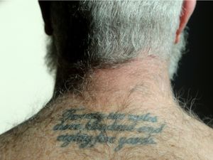 City councillor Jeff Leiper shows off his four tattoos in his Ottawa City Hall office Wed. Jan. 27, 2015. (Julie Oliver / Ottawa Citizen)