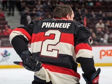 Dion Phaneuf #2 of the Ottawa Senators adjusts his jersey during the warmup.