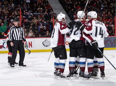 Jarome Iginla #12 of the Colorado Avalanche celebrates his first period power-play goal against the Ottawa Senators with team mates \Matt Duchene #9,Gabriel Landeskog #92 and Blake Comeau #14.