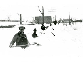 Workers attempt to clear a road near what is now Ottawa International Airport after a snowstorm in 1935.
