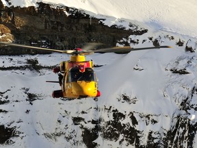 Members from 103 Squadron Gander, NL position the CH-149 Cormorant helicopter to perform a mountain rescue scenario during a Joint SAR Exercise held in Iceland on February 10, 2016. 

Photo: Master Corporal Johanie Maheu, 14 Wing Imaging, Greenwood 
GD2016-0075-14