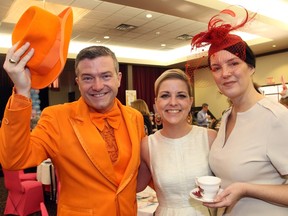 Councillor Tim Tierney (Beacon Hill-Cyrville), with his wife, Jenny, and Jacqueline Belsito, vice president of philanthropy and community engagement at the CHEO Foundation, was no shrinking violet in his head-to-toe orange attire for the inaugural Wonderland Tea Party in support of youth mental health at the Children's Hospital of Eastern Ontario, held at the Hellenic Meeting and Reception Centre on Sunday, February 21, 2016.