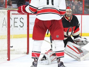 Craig Anderson of the Ottawa Senators looks stunned after #20 Riley Nash of of the Carolina Hurricanes scores on him as Jordan Staal celebrates during second period NHL action.