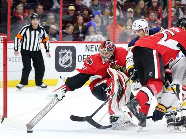 Craig Anderson of the Ottawa Senators makes the save as Brian Gionta of the Buffalo Sabres tries to score during second period NHL action.