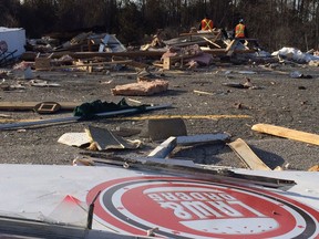 Debris is scattered across the former site of Law & Orders burger joint on Highway 7 at Innisville, west of Carleton Place, the result of an overnight explosion and fire. (Blair Crawford)