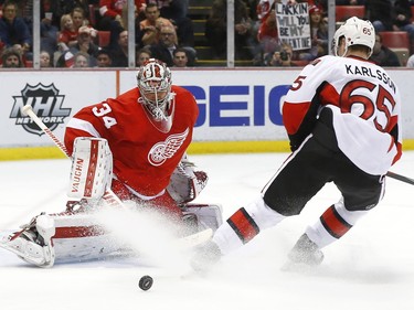 Detroit Red Wings goalie Petr Mrazek (34) stops a Ottawa Senators defenseman Erik Karlsson (65) shot in the third period.