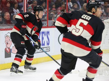 Dion Phaneuf, left, and Cody Ceci of the Ottawa Senators defence pairing against the Carolina Hurricanes during second period NHL action.