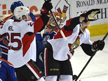 Ottawa Senators Nick Paul (13) celebrating scoring his first goal with Chris Neil (25) against Edmonton Oilers goalie Cam Talbot.