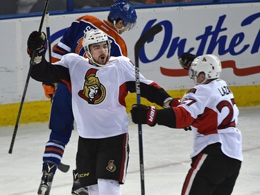Ottawa Senators Nick Paul (13) celebrates his first goal with Curtis Lazar (27) against the Edmonton Oilers.