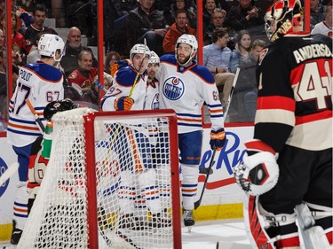 Jordan Eberle #14 of the Edmonton Oilers celebrates his first-period goal against the Ottawa Senators with teammates Benoit Pouliot #67, Connor McDavid #97 and Eric Gryba #62.