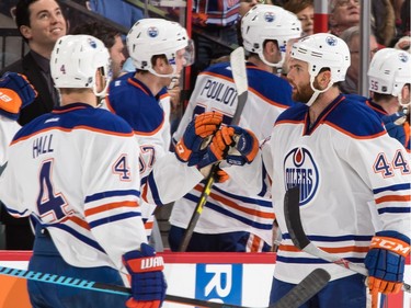 Zack Kassian #44 of the Edmonton Oilers celebrates his second-period goal against the Ottawa Senators with teammate Taylor Hall #4.