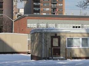 Elgin Street Public School has two portables in back, and can't handle more students. Trustees voted to send the kindergarten students to another school to ease the overcrowding.