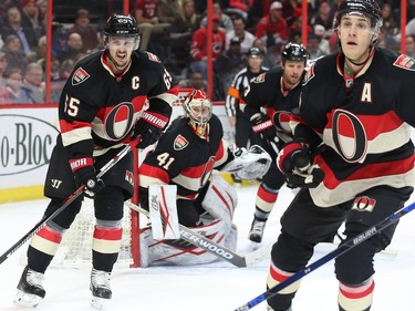 Erik Karlsson, left, Craig Anderson, Marc Methot and Kyle Turris, right, of the Ottawa Senators defence against the Carolina Hurricanes during second period NHL action.