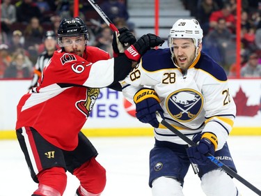 Erik Karlsson of the Ottawa Senators battles during second period NHL action.