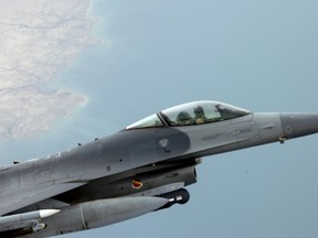 After refueling with a KC-135 Stratotanker, an F-16 Fighting Falcon continues it's close air support mission over Iraq. USAF photo.