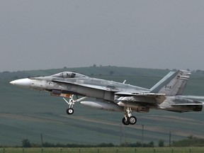 This file photo shows a Canadian CF-18 taking off from the military airbase at Campia Turzii. Canada will end air strikes targeting the Islamic State group in Iraq and Syria and bring home its six fighter jets by Feb. 22.