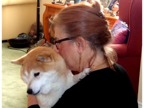 SafePet president AJ Sher, seen with her Shiba Inu, has a message for women experiencing domestic violence: 'When you are ready to leave, we are ready to foster for you. We want you to have a happy ending.'