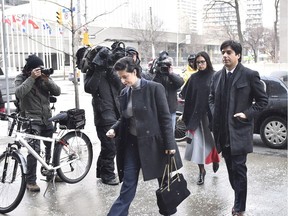 Former CBC radio host Jian Ghomeshi and his lawyer Marie Henein arrive at a Toronto court on Wednesday, Feb. 10, 2016.