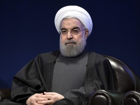 Iranian President Hassan Rouhani looks on during a meeting with the French Prime Minister.