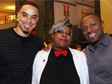 From left, Alic Edgar with Patrice James, executive director of the Independent Filmmakers Co-operative of Ottawa, and soccer coach Roland Tiamuh at On the  Rocks: In the Caribbean, an annual Winterlude party hosted by the Ottawa Art Gallery at City Hall on Friday, February 5, 2016. (Caroline Phillips / Ottawa Citizen)