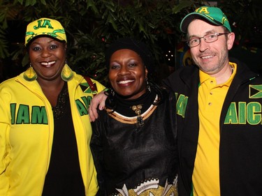 From left, Marlene Grant, seen alongside Sarah Onyango, proudly displayed her Jamaican heritage with husband David O'Connor at On the Rocks: In the Caribbean, an annual party hosted by the Ottawa Art Gallery at City Hall on Friday, February 5, 2016. (Caroline Phillips / Ottawa Citizen)