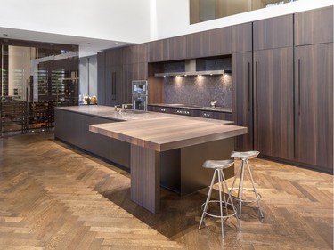 In this kitchen by Veronica Martin Design Studio, the elongated hood from Gaggenau Appliances is distinctive, yet works seamlessly with the kitchen design, which is key for Martin.
