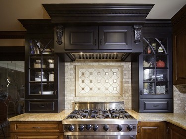Dramatic in black, this wood hood makes a statement while integrating a Viking ventilation unit.
