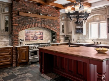 A classic brick surround adds to the Tuscany feel of this kitchen makeover by Irpinia Kitchens.