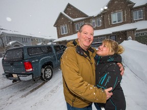 Gerry Marsh, posing outside his home with his girlfriend Marie-Paule Briere, was the hero of the neighbourhood on Tuesday evening when he used his pick-up truck to pull a bus loaded with passengers out of a snow bank in the Orleans Avalon area.