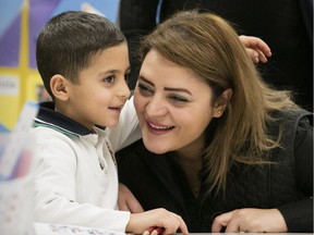 Giana Maatouq visits with her 5-year-old son, Gebran during his first full day of school at École élémentaire catholique Montfort on Jan. 14. Gebran and his sister Katia, 7, were among the first Syrian refugees to register in an Ottawa school.