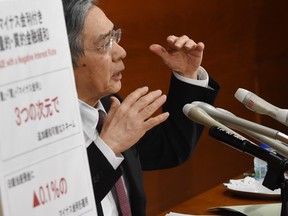 Governor of the Bank of Japan (BoJ) Haruhiko Kuroda answers a question during his regular press conference in Tokyo on January 29, 2016.  The BoJ shocked markets on January 29 after it unveiled plans to effectively charge lenders to park their cash with it, ramping up its long-running battle to kickstart the world's number three economy.