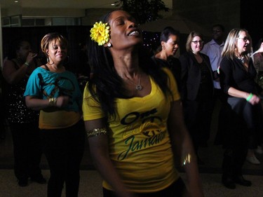 Julia Valcin, seen in front, was part of an audience participation Jamaican Funk dance, led by Suzan Lavertu from the School of Afro-Caribbean Dance, at On the  Rocks: In the Caribbean, an annual Winterlude party hosted by the Ottawa Art Gallery at City Hall on Friday, February 5, 2016. (Caroline Phillips / Ottawa Citizen)