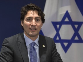 Canadian Prime Minister Justin Trudeau makes opening remarks at the start of a bilateral meeting with Israel at the United Nations climate change summit Monday, November 30, 2015 in Le Bourget, France.