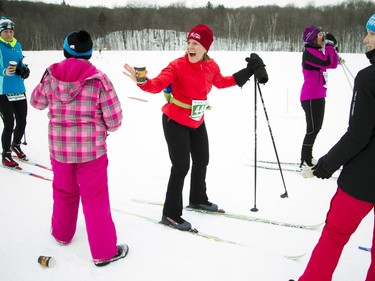 Kate Smith reacts to friends cheering her on during the 27km Classique race at the Gatineau Loppet that took place Saturday February 27, 2016.