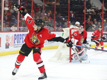 Kyle Turris of the Ottawa Senators battles with his stick against the Buffalo Sabres during second period NHL action.