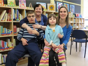 L-R: Christian Rowe, Romaine Derhak (Christian's mother), Nathalie Slaunwhite, Françoise Slaunwhite (Nathalie's mother) at Clufford Bowey School. Parents are upset about the possible closure of a summer school for kids with developmental delays.